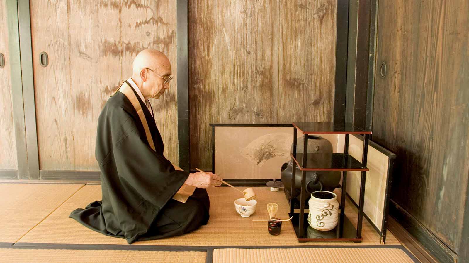 Old Japanese man preparing matcha