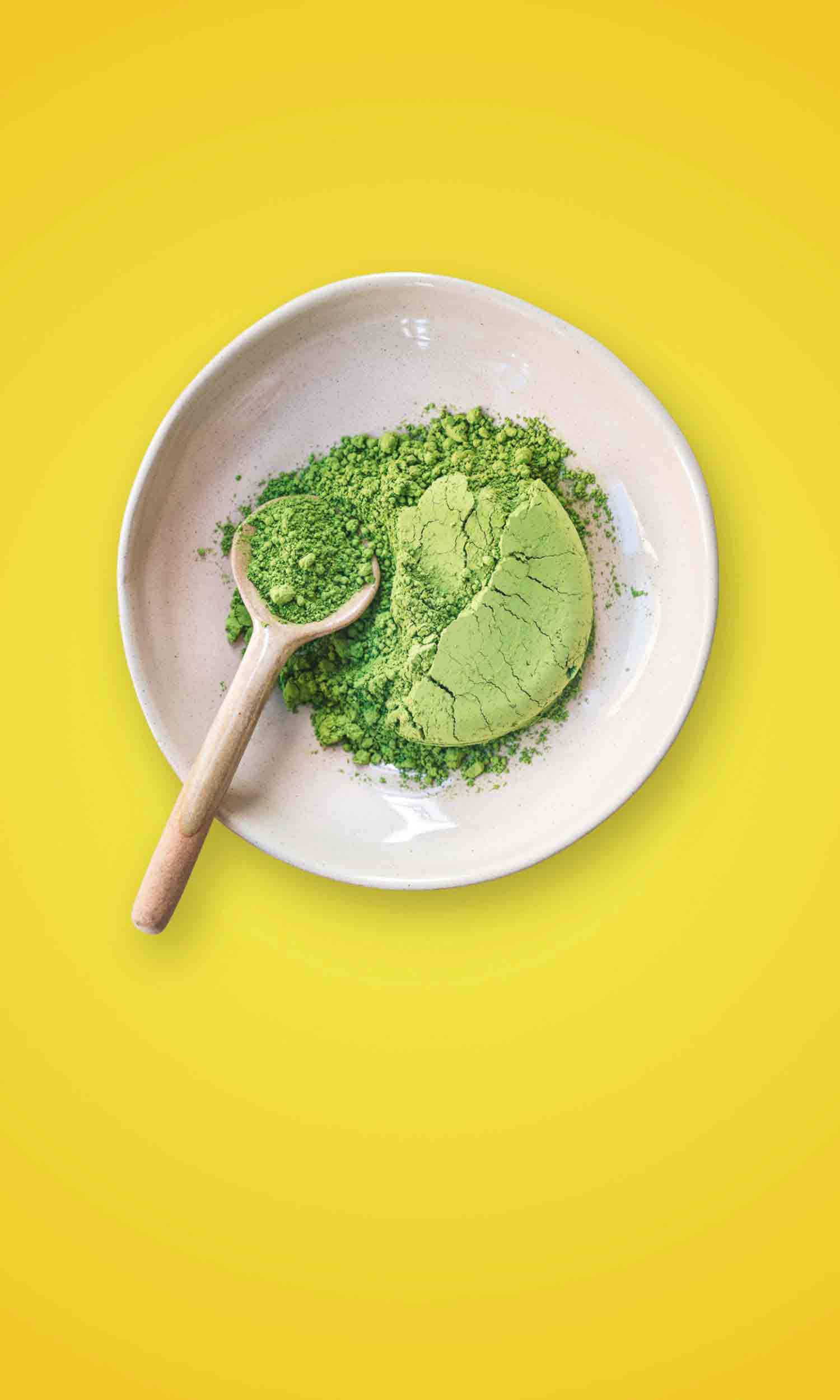 Matcha in a bowl over a yellow background