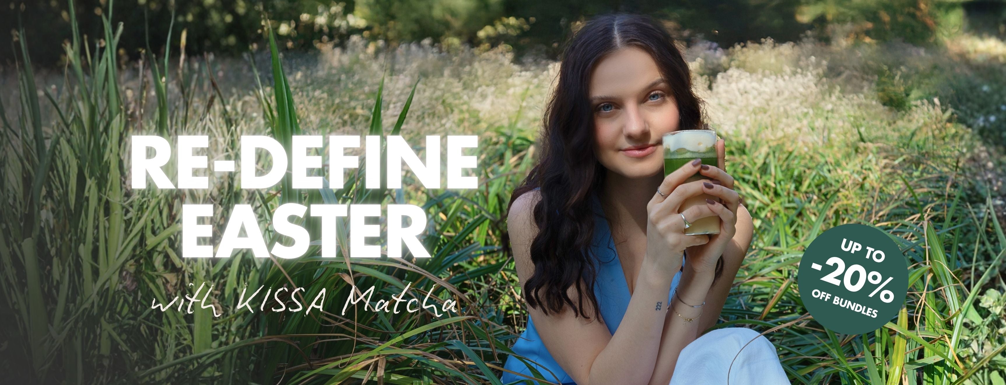 Girl is sitting in the nature and drinks a Matcha Latte
